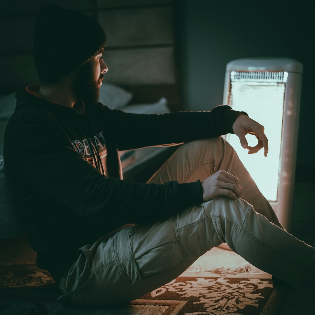 Finnish lighting technician adjusting a studio softbox light