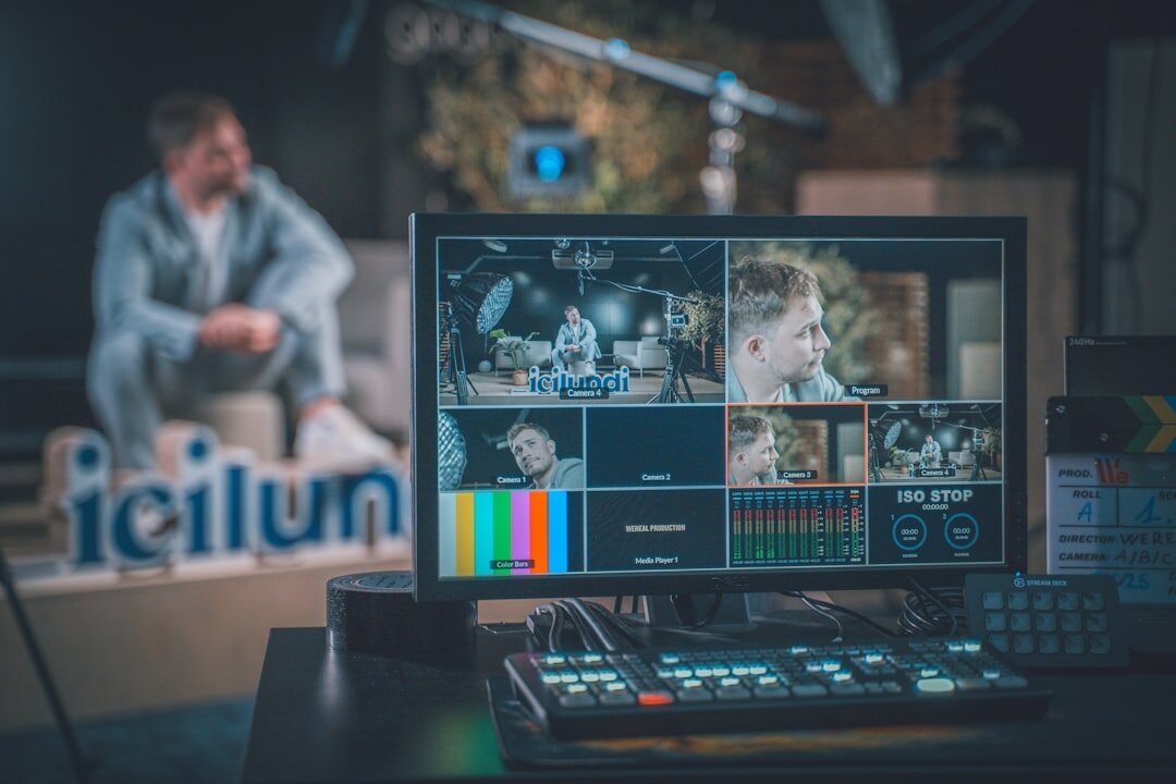 TV studio control room with camera operator filming a news desk